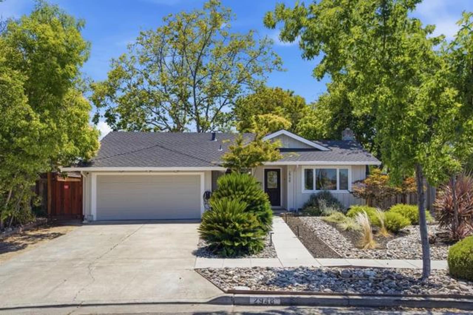 The client's photograph of the same house at noon.